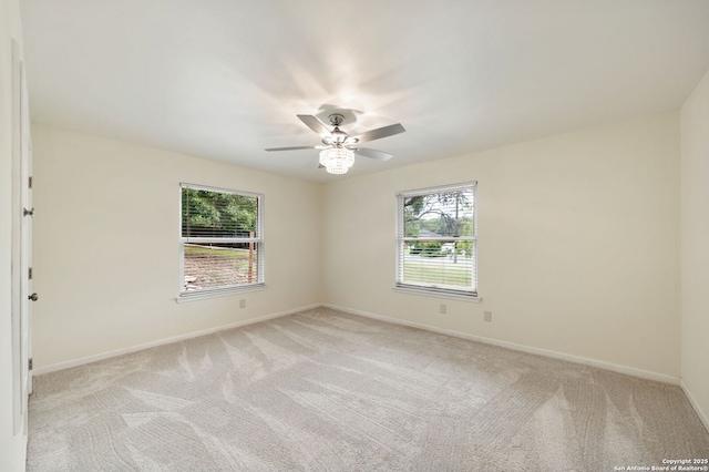 3918 Midvale, San Antonio, TX 78229 - unfurnished room featuring healthy amount of natural light, light carpet, and baseboards