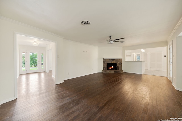 3918 Midvale, San Antonio, TX 78229 - unfurnished living room with ceiling fan, dark wood-type flooring, a fireplace, crown molding, and baseboards