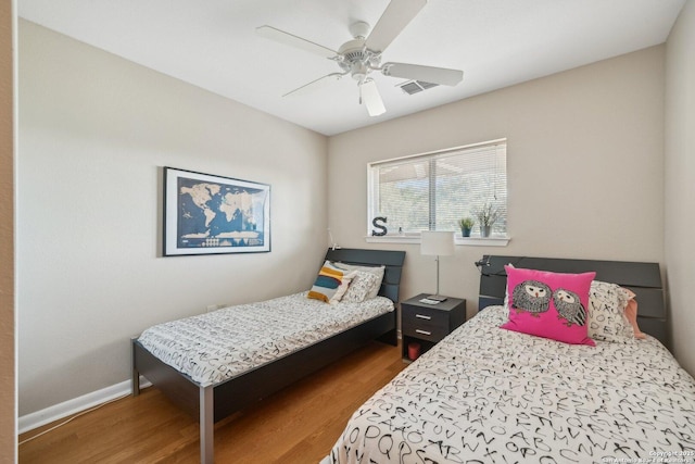 4111 Medical Dr Unit A 204, San Antonio, TX 78229 - bedroom with wood finished floors, a ceiling fan, and baseboards