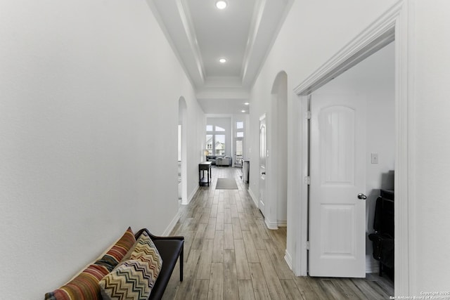 1105 Limestone, New Braunfels, TX 78132 - hall featuring baseboards, arched walkways, light wood-style floors, crown molding, and recessed lighting
