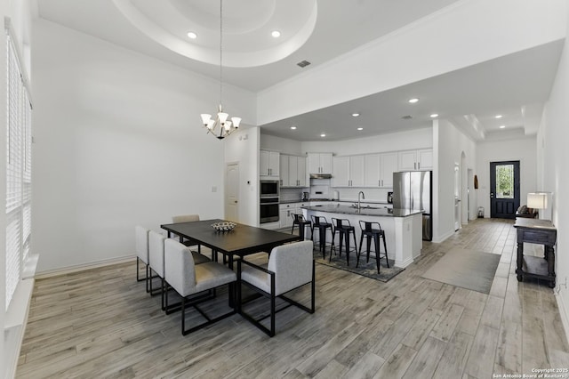 1105 Limestone, New Braunfels, TX 78132 - dining room featuring a chandelier, light wood finished floors, visible vents, and recessed lighting