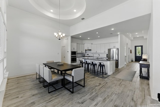 1105 Limestone, New Braunfels, TX 78132 - dining space with recessed lighting, light wood-type flooring, and an inviting chandelier