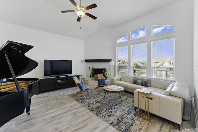 1105 Limestone, New Braunfels, TX 78132 - living area with light wood-type flooring, high vaulted ceiling, ceiling fan, and plenty of natural light