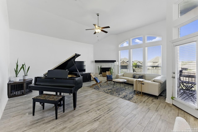1105 Limestone, New Braunfels, TX 78132 - interior space featuring a premium fireplace, light wood-type flooring, high vaulted ceiling, and a ceiling fan