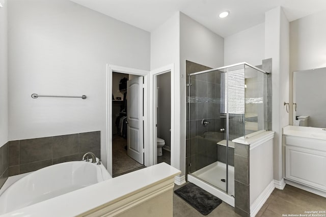 1105 Limestone, New Braunfels, TX 78132 - full bathroom featuring tile patterned floors, toilet, vanity, and a stall shower
