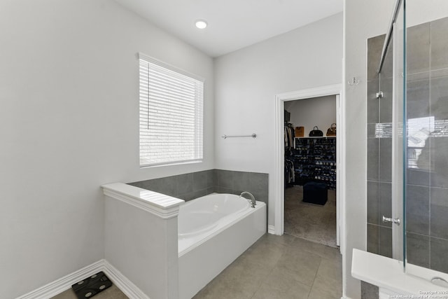 1105 Limestone, New Braunfels, TX 78132 - full bathroom featuring tiled shower, a garden tub, a spacious closet, and tile patterned flooring