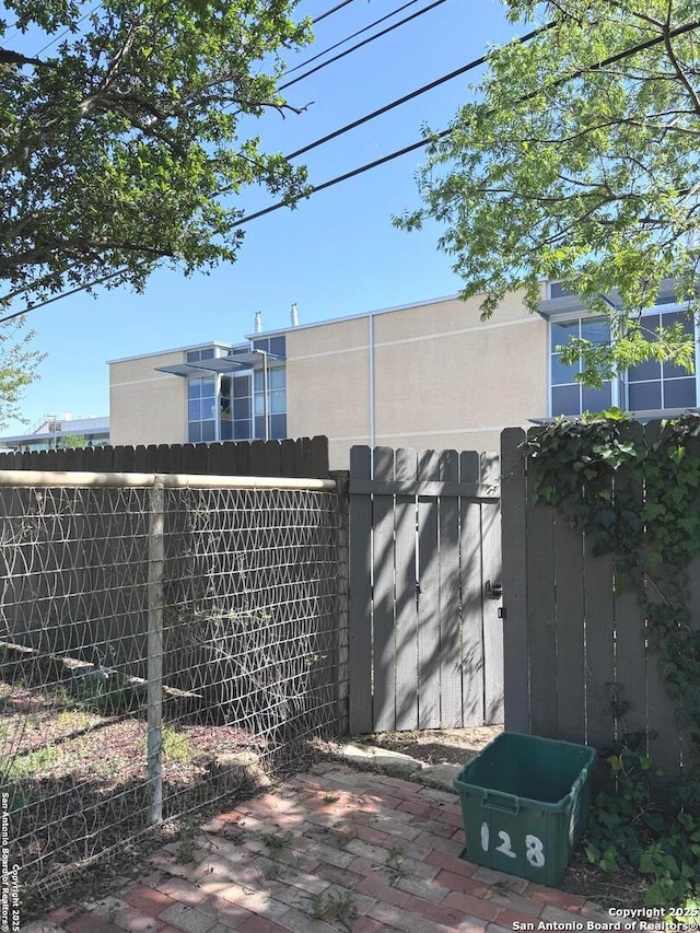 view of gate featuring fence