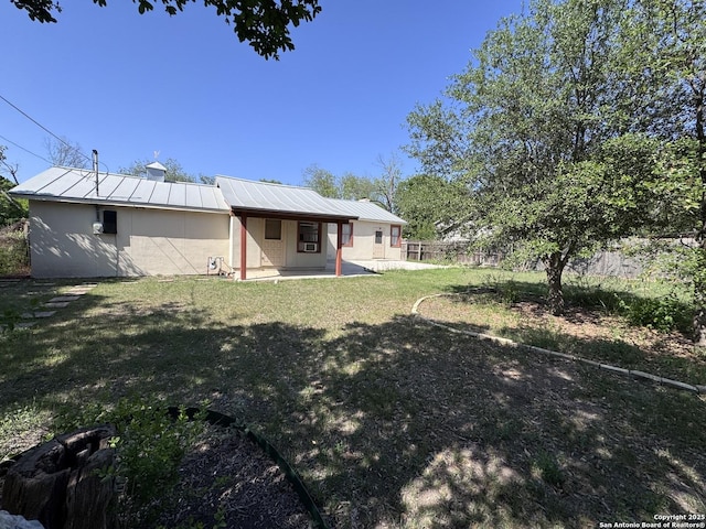 view of yard featuring a patio area and fence