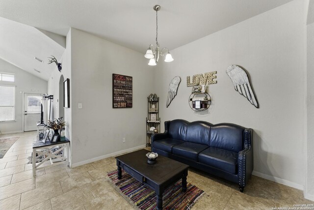 living area featuring baseboards, an inviting chandelier, and vaulted ceiling