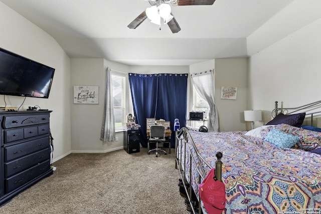 carpeted bedroom featuring baseboards and ceiling fan