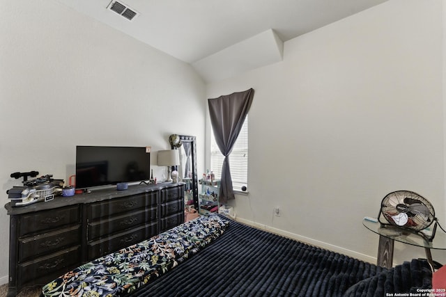bedroom featuring visible vents, baseboards, vaulted ceiling, and carpet floors
