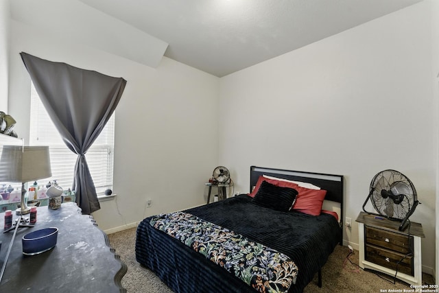 bedroom with baseboards and carpet floors