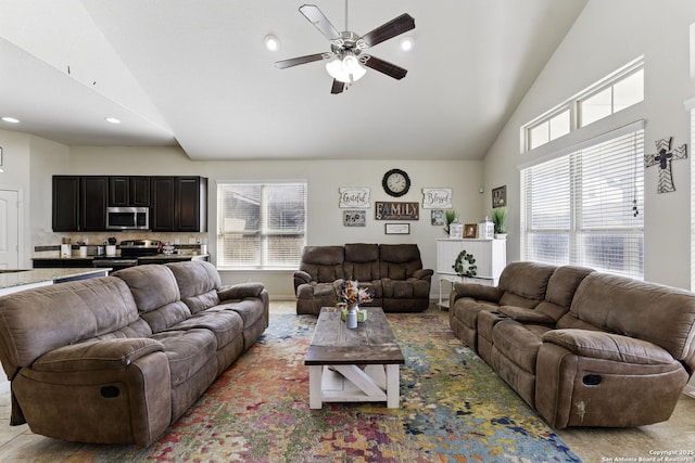 living area featuring high vaulted ceiling, ceiling fan, plenty of natural light, and recessed lighting
