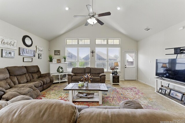 living room with high vaulted ceiling, a ceiling fan, visible vents, and a wealth of natural light