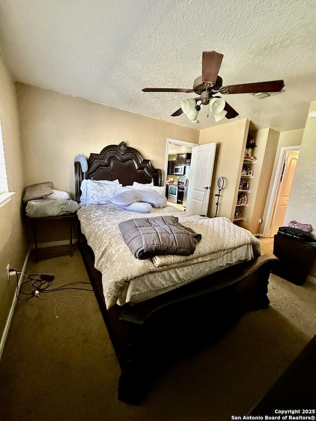 bedroom with a textured ceiling, ceiling fan, baseboards, and carpet