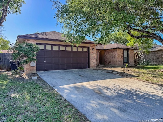 single story home featuring roof with shingles, driveway, brick siding, a garage, and fence