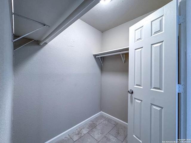 walk in closet featuring tile patterned floors