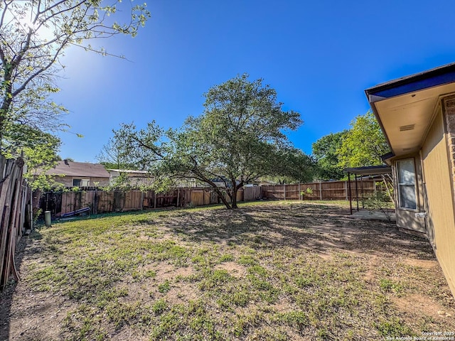 view of yard with a fenced backyard