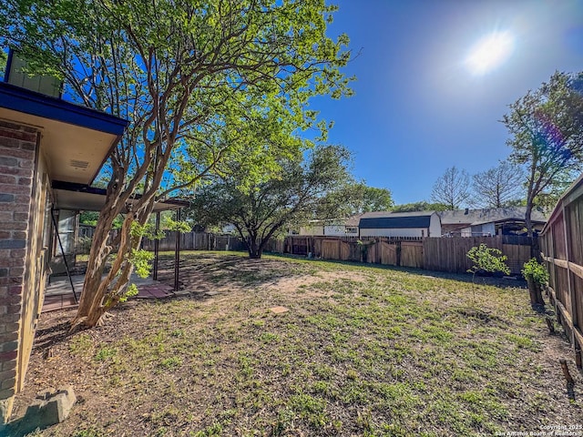 view of yard featuring a fenced backyard