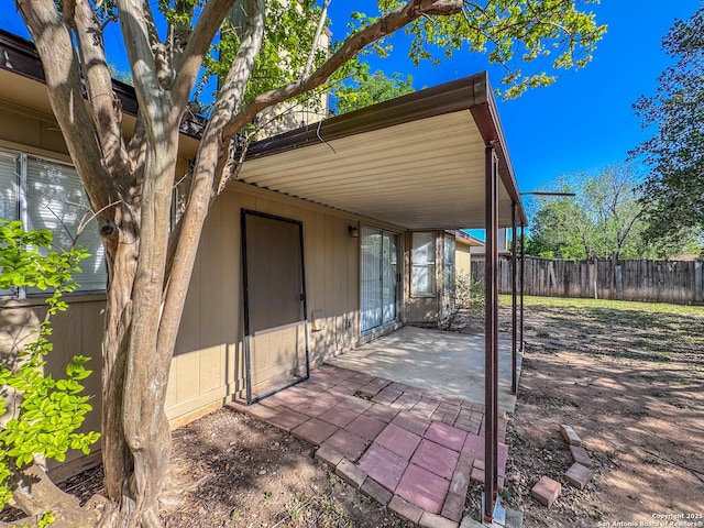 view of patio / terrace featuring fence