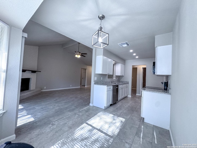 kitchen with visible vents, a sink, open floor plan, ceiling fan, and stainless steel appliances
