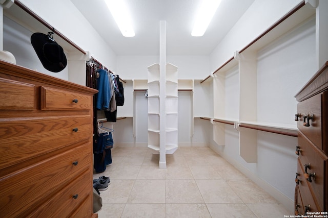 spacious closet featuring light tile patterned flooring
