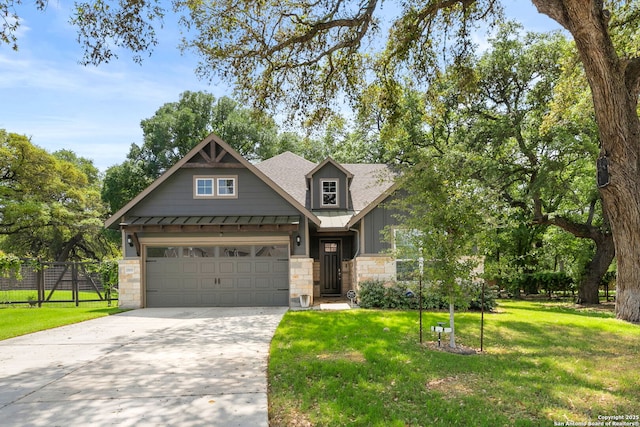 craftsman inspired home with driveway, stone siding, a standing seam roof, metal roof, and fence