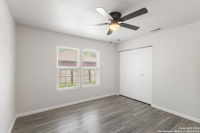 243 Alicia Ave, San Antonio, TX 78228 - unfurnished bedroom featuring visible vents, baseboards, a closet, and wood finished floors