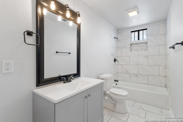 243 Alicia Ave, San Antonio, TX 78228 - bathroom with toilet, marble finish floor, shower / washtub combination, and vanity