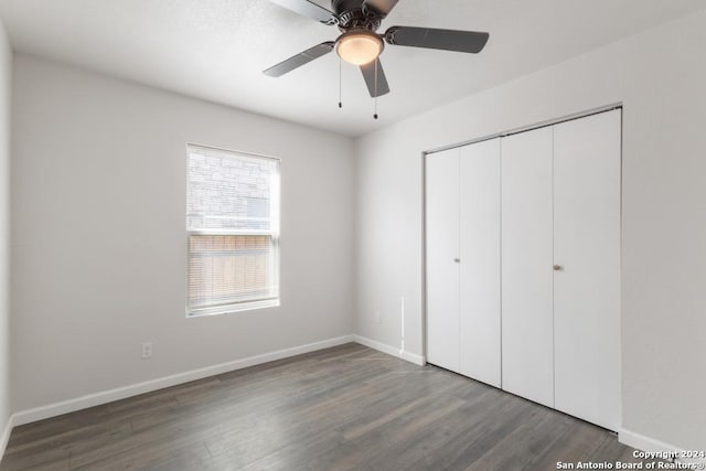 243 Alicia Ave, San Antonio, TX 78228 - unfurnished bedroom featuring a closet, baseboards, and wood finished floors