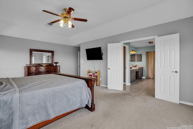 8114 Pimlico Ln, Boerne, TX 78015 - bedroom with visible vents, baseboards, ceiling fan, ensuite bath, and light colored carpet
