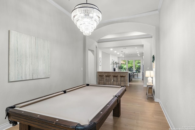 1064 Spanish Trl, New Braunfels, TX 78132 - recreation room with crown molding, pool table, arched walkways, wood finished floors, and baseboards