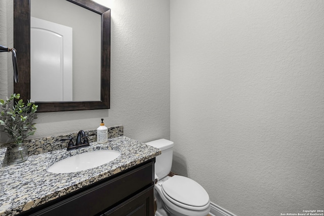 1064 Spanish Trl, New Braunfels, TX 78132 - half bathroom featuring toilet, a textured wall, and vanity
