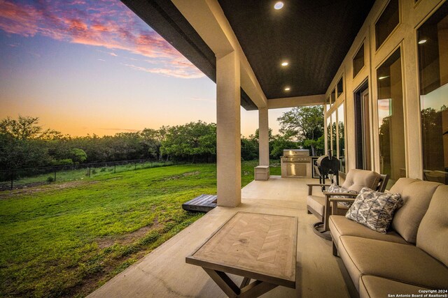 1064 Spanish Trl, New Braunfels, TX 78132 - view of patio / terrace featuring outdoor lounge area, fence, and an outdoor kitchen