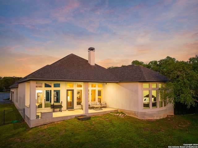 1064 Spanish Trl, New Braunfels, TX 78132 - back of property with a lawn, roof with shingles, a patio, fence, and a chimney