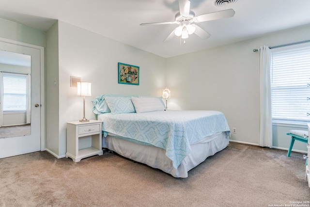 bedroom with baseboards, visible vents, carpet, and ceiling fan