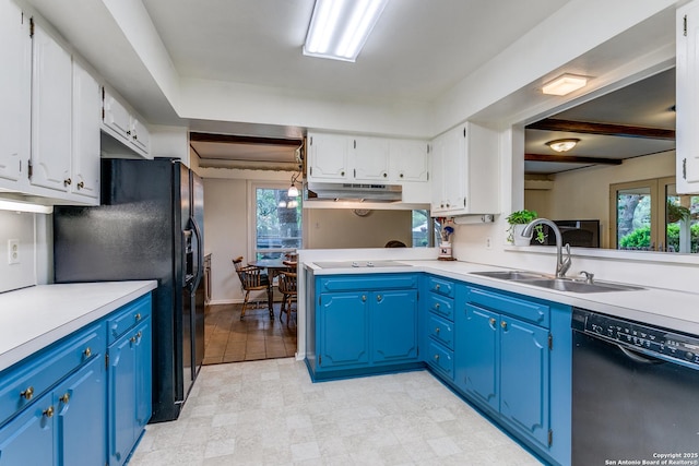 kitchen with white cabinets, a sink, blue cabinetry, under cabinet range hood, and black appliances