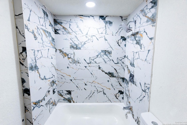 full bathroom featuring washtub / shower combination and toilet