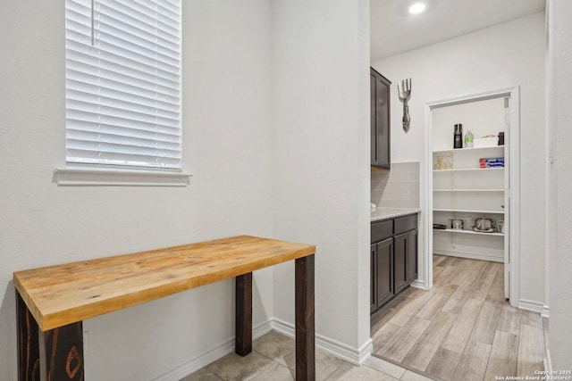 corridor featuring light wood-style floors