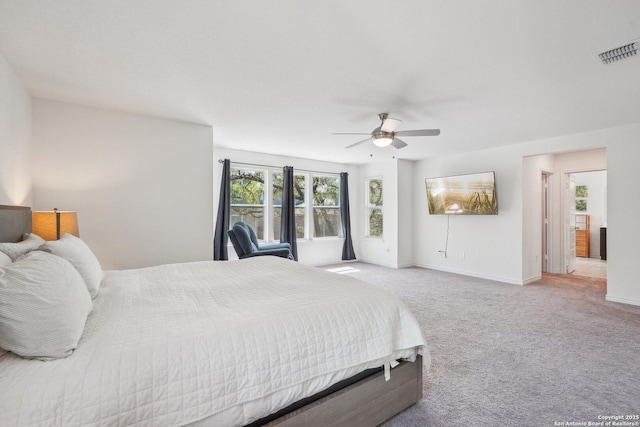 bedroom featuring a ceiling fan, baseboards, carpet, and visible vents