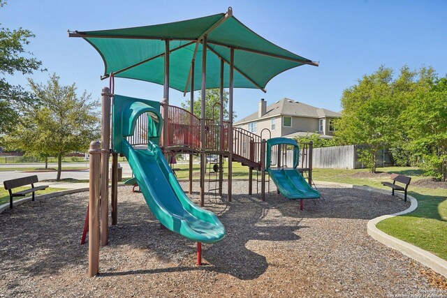 community play area featuring fence