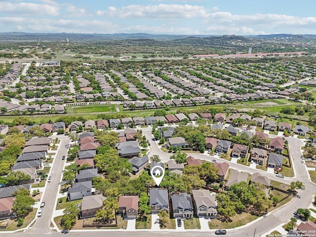 birds eye view of property with a residential view