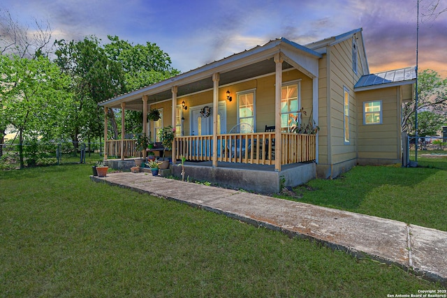 6432 Fm725, New Braunfels, TX 78130 - bungalow with metal roof, a front yard, covered porch, and fence