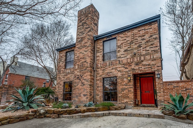 527 Thelma Dr, Olmos Park, TX 78212 - view of front of home with a chimney and brick siding
