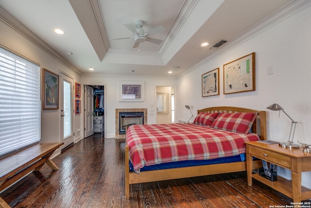 527 Thelma Dr, Olmos Park, TX 78212 - bedroom featuring a raised ceiling, ornamental molding, visible vents, and hardwood / wood-style flooring