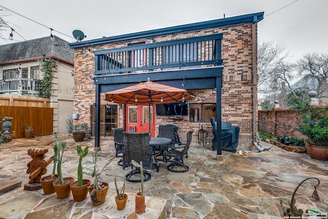 527 Thelma Dr, Olmos Park, TX 78212 - view of patio with a fenced backyard, outdoor dining area, and a balcony