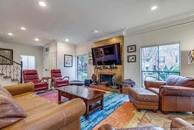 527 Thelma Dr, Olmos Park, TX 78212 - living room featuring a large fireplace, recessed lighting, crown molding, and a healthy amount of sunlight