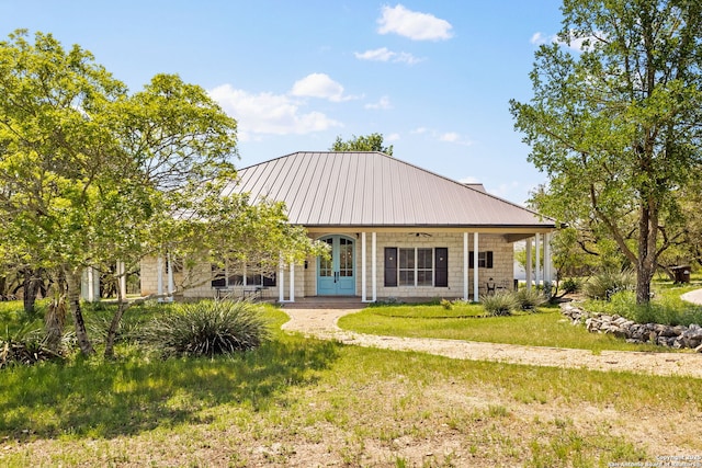 23954 Cibolo Vw, San Antonio, TX 78266 - back of house with metal roof, french doors, and a lawn