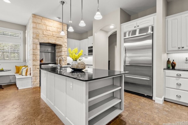 23954 Cibolo Vw, San Antonio, TX 78266 - kitchen with built in refrigerator, white cabinetry, open shelves, and dark countertops