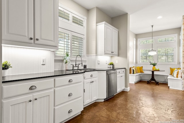 23954 Cibolo Vw, San Antonio, TX 78266 - kitchen with white cabinets, dishwasher, a sink, dark countertops, and finished concrete floors